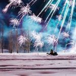 man on snowmobile enjoying snowfest fireworks display